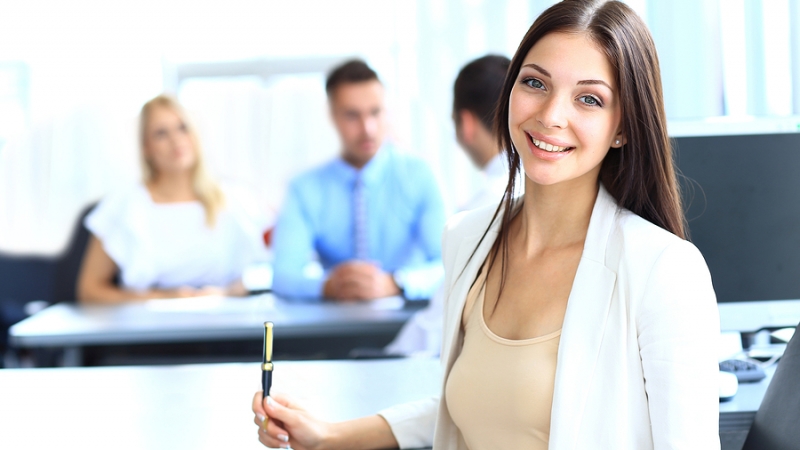 Business woman with her team at the office